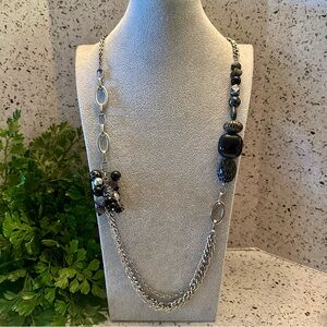 CHICO’S long silver chain and black bead necklace.